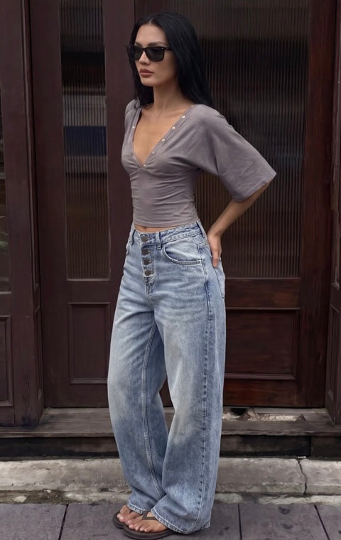 Jean femme bleu délavé taille haute coupe arrondie